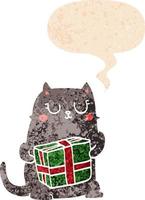 gato de navidad de dibujos animados y burbuja de habla en estilo retro texturizado vector