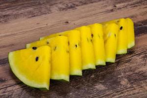 Sliced sweet tasty yellow watermelon photo