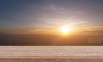 empty wooden tabletop with mountain in morning time. countryside landscape. photo