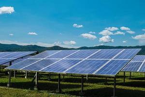 Solar module panels against blue sky background. Environmental energy resources concept. photo