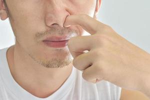 Close-up of Guy picking his nose photo