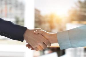 Close-up image of businessman handshake. Business partnership meeting concept. photo