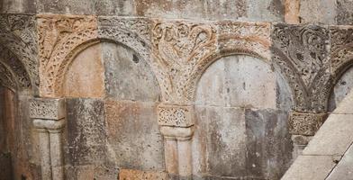 Patterns and signs of animals on old buildings in Ani archeological site in Turkey photo