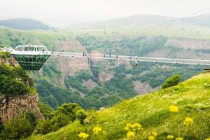 Dashbashi, Georgia , 2022 - static view Diamond shape platform on glass bridge over scenic dashbashi valley in Georgia countryside. Famous modern bridge over valley in caucasus photo