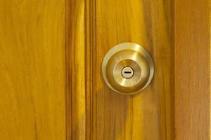 Wooden door with doorknob photo