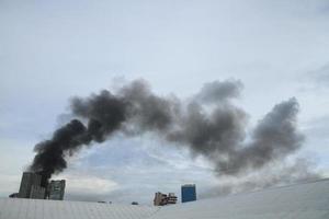 Black smoke from fire burning on the sky photo