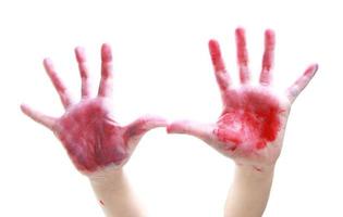 Red ink on boy's hand photo