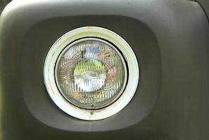 Headlight of vintage car photo