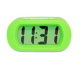 Green digital electronic clock isolated on white background photo