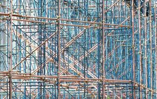 Temporary scaffolding for construction works at building site photo