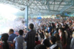 A blurred Asian crowd in a stadium photo