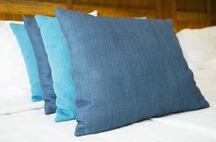 Close up imsage of row of blue pillows photo