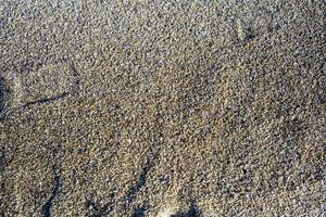 textura de arena playa de arena para el fondo. vista superior foto