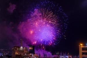 Fireworks over the bay and port of the city. Vladivostok, Russia photo