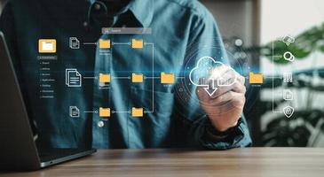 Man using laptop showing cloud computing diagrams digital technology information exchange and future technology ideas Data Document Management System photo