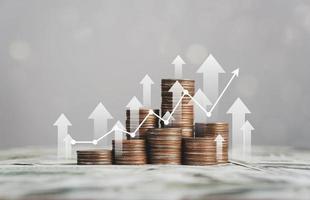 stack of silver coins with trading chart in financial concepts and financial investment business stock growth photo