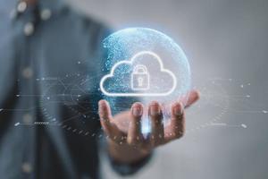 Cloud computing technology database storage security concept Backup transfer. There is a large cloud icon on the right in an abstract world on businessman. photo