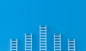 Ladder achievement concept on blue wall studio background. leadership, success concept with copy spaces for text. 3d rendering. photo