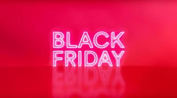 Black Friday neon sign on red studio background. Glowing white and red neon text for advertising and promotion. photo