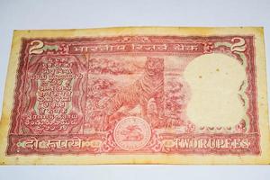 Old Two Rupee notes combined on the table, India money on the rotating table. Old Indian Currency notes on a rotating table, Indian Currency on the table photo