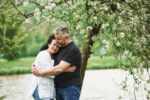 Peaceful mood. Cheerful couple enjoying nice weekend outdoors. Good spring weather photo