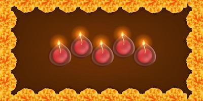 Happy diwali. oil lamp candle with marigold flower frame on the dark background for greeting card template