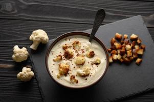 Creamy cauliflower soup with homemade croutons.