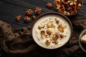 Creamy cauliflower soup with homemade croutons.