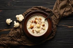 Creamy cauliflower soup with homemade croutons. photo