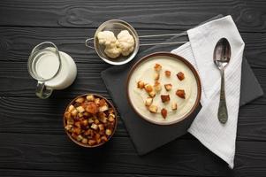 Creamy cauliflower soup with homemade croutons. photo
