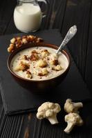 Creamy cauliflower soup with homemade croutons. photo