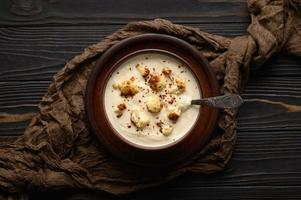 Creamy cauliflower soup with homemade croutons. photo