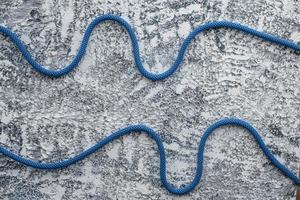 This is for the safety. Isolated photo of climbing knots. Cables lying on the white and grey colored surface