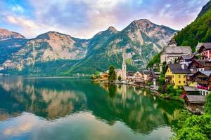 Scenic view of famous Hallstatt village and Hallstatter lake in the Austrian Alps photo