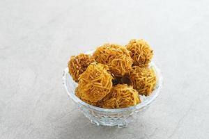 Grubi, Indonesian snack made from sweet potato with crispy texture and sweet taste. This grubi has a round shape. photo