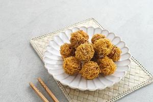 Grubi, Indonesian snack made from sweet potato with crispy texture and sweet taste. This grubi has a round shape. photo