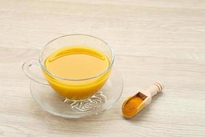 Turmeric tea, herbal drink. Indonesian traditional drink. Spices for alternative medicine concept. Copy space. photo