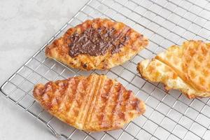 Caramelized Croissant Waffle or Croffle  with chocolate sauce photo