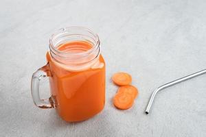 A glass of fresh carrot juice, very good for health. photo