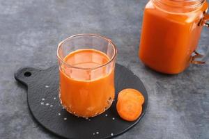 A glass of fresh carrot juice, very good for health. photo