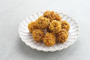 Grubi, Indonesian snack made from sweet potato with crispy texture and sweet taste. This grubi has a round shape. photo