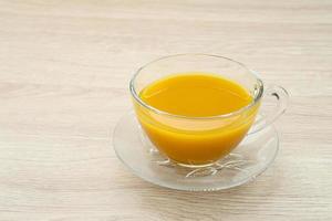 Turmeric tea, herbal drink. Indonesian traditional drink. Spices for alternative medicine concept. Copy space. photo