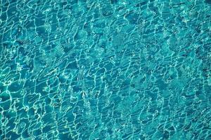 Turqouise colour on the pool water surface with a lot of wave around for background or backdrop of any graphic design photo