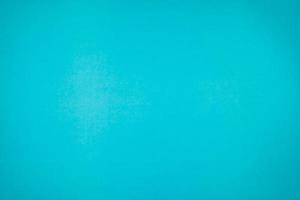 A little mottled bright blue turquoise paper plain and solid for minimal object background. photo