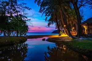 Purple violet sky at the beach and sea, in Twilight Time, Koh Kood, Trad province, Thailand. photo