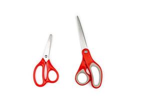 two red scissors, one big, one small are isolated on white background. Clipping paths