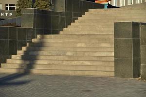 Stone grand staircase in a large building in summer photo