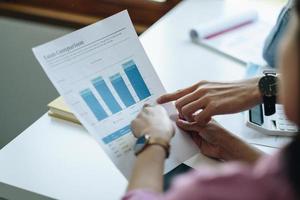 Business People Meeting to analyse and discuss and brainstorming the financial report chart data in office Financial advisor teamwork and accounting concept photo