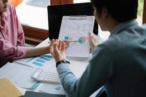 Business People Meeting to analyse and discuss and brainstorming the financial report chart data in office Financial advisor teamwork and accounting concept photo