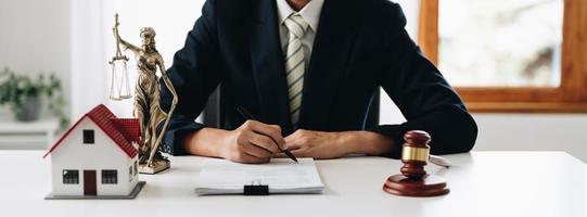 law concept, lawyer woman hoding pen with contract or agreement document to customer for signing in courtroom legal photo